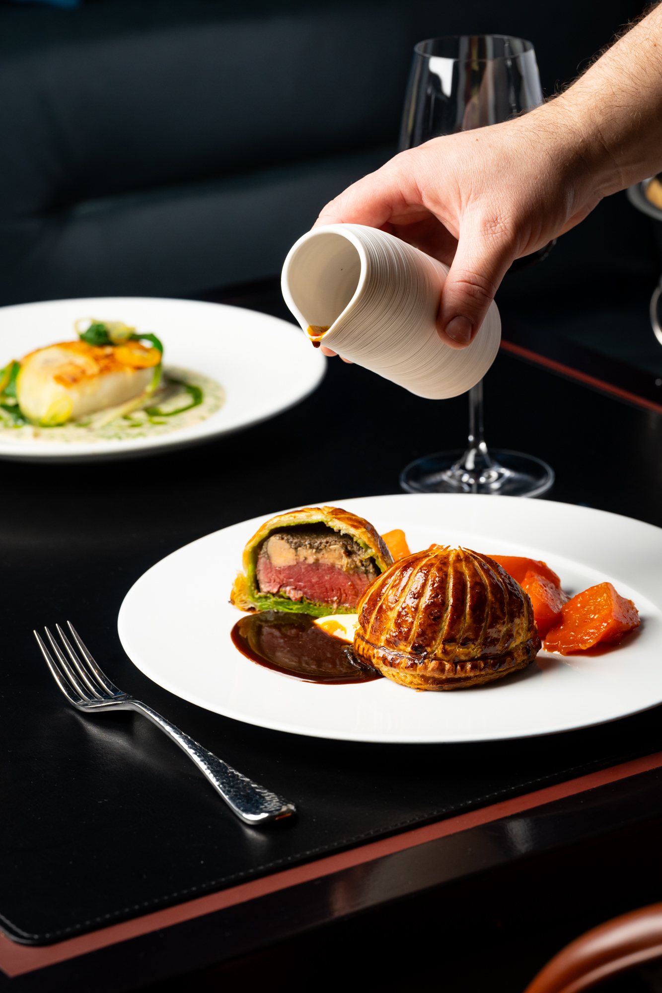 Beef Wellington with sauce at Restaurant Lucie